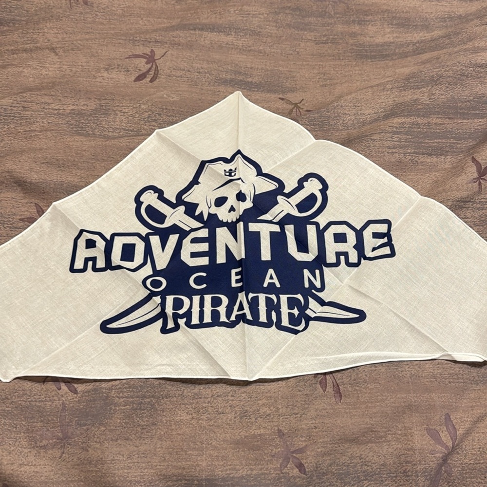 Triangular, pirate bandanna. White with blue detail. From Royal Caribbean. New.